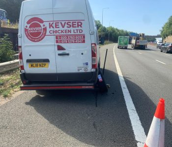 Emergency mobile tyre rescue on a van on the motorway.