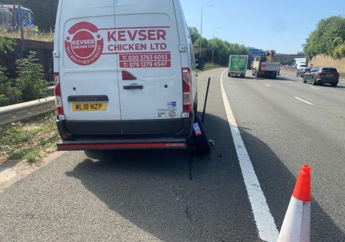 Emergency mobile tyre rescue on a van on the motorway.